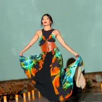 A model walks the runway at a LuxeArt fashion show